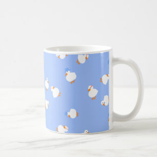 Taza de café azul con patos lindos ilustrados a ma
