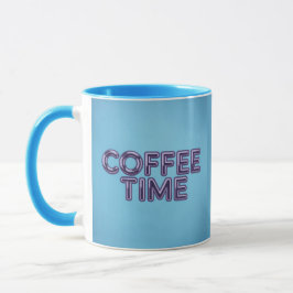 Taza de café azul turquesa con texto morado