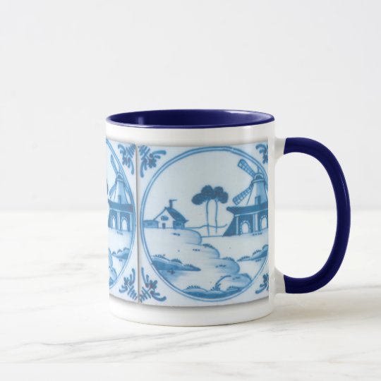 Taza de café blanca azul del molino de viento de