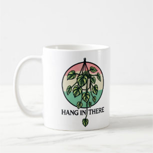 Taza De Café Colgar en la planta colgante de la planta de posan