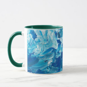 Taza de café con acuarela azul y asa verde