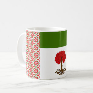 Taza de café con el emblema de la población de la