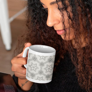 Taza de café con patrón geométrico continuo