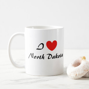 Taza de café con tipografía de corazón «Amo Dakota