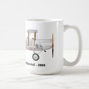 Taza de café con un biplano en él