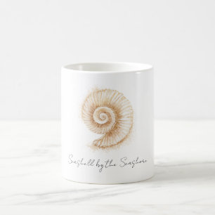 Taza De Café Concha junto a la orilla