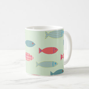 Taza de café costera con patrón de peces coloridos