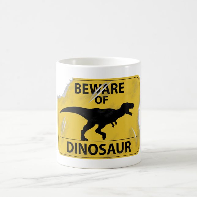 Taza De Café Cuidado con los dinosaurios (dañados) (Centro)