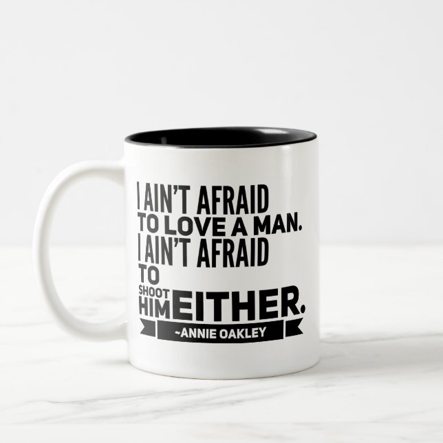 Taza de café de la cita de Annie Oakley (Izquierda)