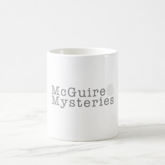 Taza de café del logotipo de los misterios de