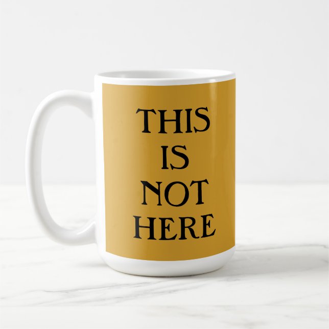 Taza De Café Esto No Está Aquí, Café Mug (Izquierda)