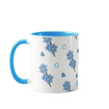 Taza de café floral blanca y azul