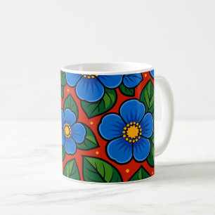 Taza De Café Flores azules y hojas verdes sobre un fondo rojo
