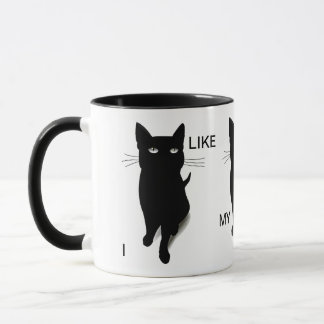 Taza de café fresca del gato negro por las