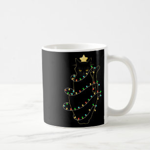 Taza De Café Gato negro de Santa enredado en la luz del árbol d