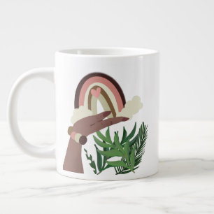 Taza De Café Gigante Arcoíris Boho en mano de mujer con vegetación