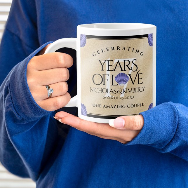 Taza De Café Gigante Elegante aniversario Boda de 17 conchas (17th wedding anniversary jumbo mug held by woman sporting a wedding ring and blue sweatshirt.)