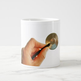 Taza De Café Gigante Stethoscoop in een hand voor een ziekenhuis sfeer.