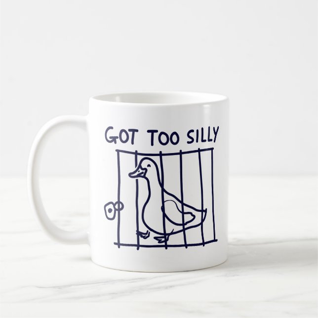 Taza De Café "Got Too Silly" Duck in a Cage Mug (Izquierda)