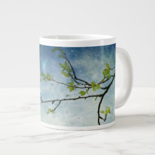 Taza De Café Grande Rama de árbol sobre el cielo texturizado