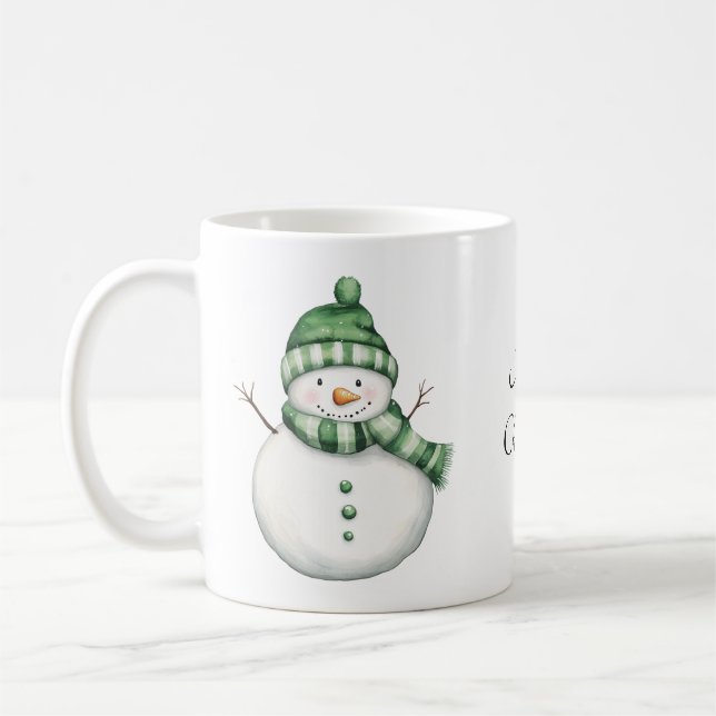 Taza De Café Hombre de nieve con sabor a bufanda verde y beanie (Izquierda)
