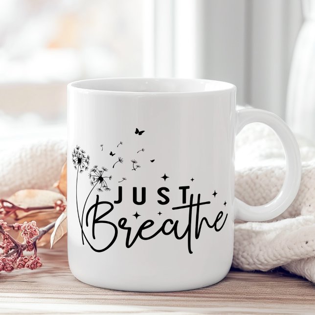 Taza De Café "Just Breathe" Dandelion Butterfly ("Just Breathe" Dandelion Butterfly Coffee Mug on a boho wooden table with pink flower.)