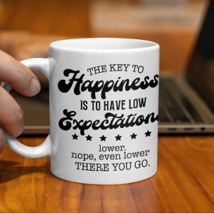 Taza De Café La clave para la felicidad, la baja expectativa di