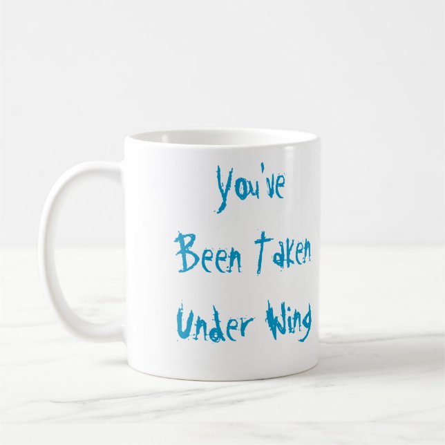 Taza De Café Le han tomado debajo del ala (Izquierda)