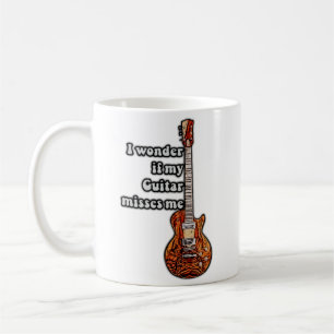 Taza De Café Me pregunto si mi guitarra me extraña.