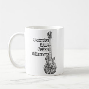 Taza De Café Me pregunto si mi guitarra me extraña. Blanco y ne