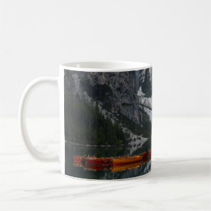 TAZA DE CAFÉ NARANJA CANOE EN EL CUERPO DEL AGUA