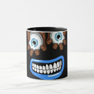 Taza de café negra con cara de monstruo espeluznan