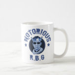 Taza De Café Notorio RBG III<br><div class="desc">Ruth Bader Ginsburg con una corona y gafas oscuras,  con "Notorious R.B.G" con letras de insignia. Tonos azules. Camisetas,  franja de regalo de novedad.</div>
