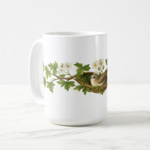 Taza De Café Pájaro en nido de pájaro en ramas florecidas