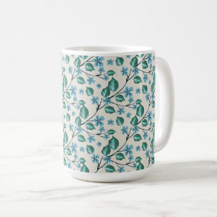Taza De Café Ramitas con hojas verdes y flores azules.