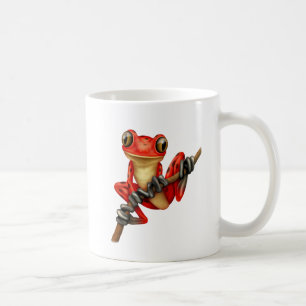 Taza De Café Rana arbórea roja linda en una rama