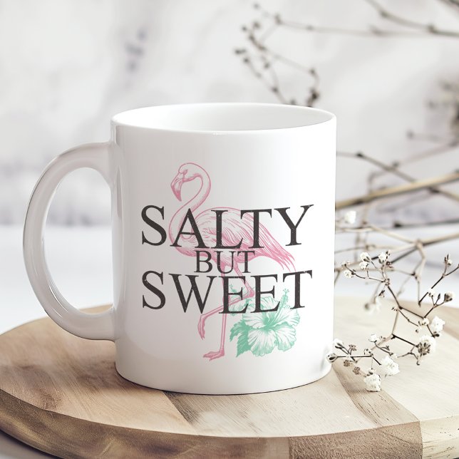 Taza De Café "Salado pero dulce" Flamingo ("Salty but Sweet" Flamingo Coffee Mug on a sunny boho wooden kitchen table.)