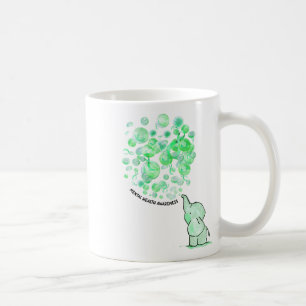 Taza De Café Salta a la luz globos verdes y toma de conciencia 