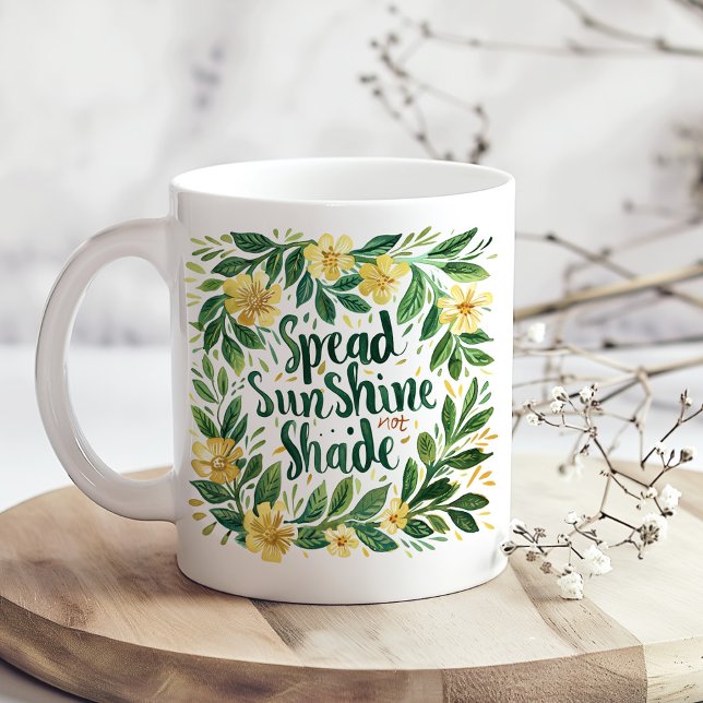 Taza De Café "Spread SunShine" amarillo y floral verde ("Spread SunShine" Yellow and Green Floral Coffee Mug on a boho kitchen table with white dry flowers)