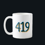 Taza De Café The 419 - Toledo, Ohio<br><div class="desc">The design focuses on the "419, " the iconic area code that has become a symbol of local identity and community pride for Toledoans. Set in a bold, modern typeface, the numbers represent more than just a telephone prefix; they represent the spirit of a city built on industrial ingenuity, the...</div>
