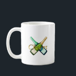 Taza De Café Toasting with a bottle<br><div class="desc">"Toasting with a bottle" features a striking design of crossed champagne bottles and the word "Cheers, " creating a celebratory mood. It's the perfect item to add color to special moments such as parties,  anniversaries,  and the New Year holidays. It creates a glamorous and fun atmosphere.</div>