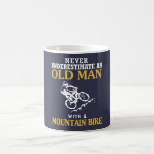 TAZA DE CAFÉ VIEJO HOMBRE CON UNA BICI DE MONTAÑA