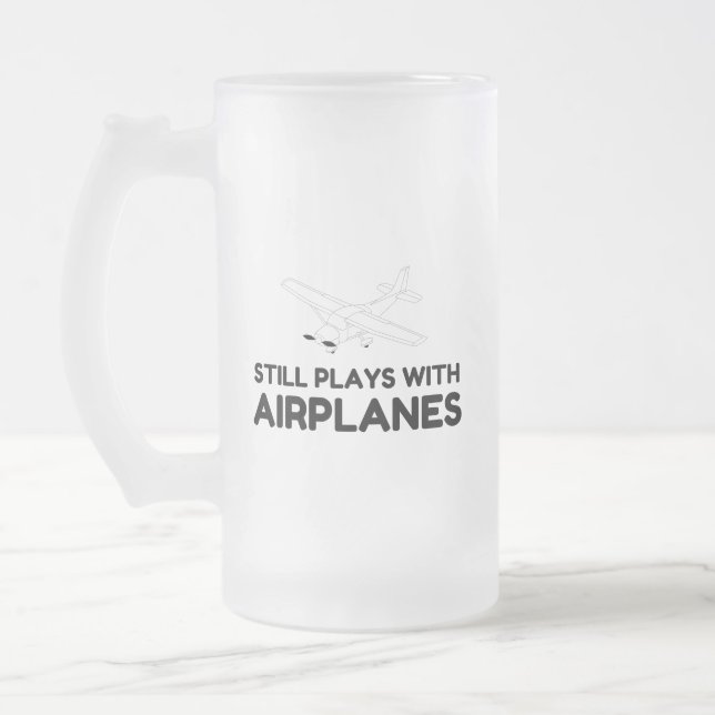 TAZA DE CRISTAL ESMERILADO JUEGOS CON AVIÓN (Izquierda)
