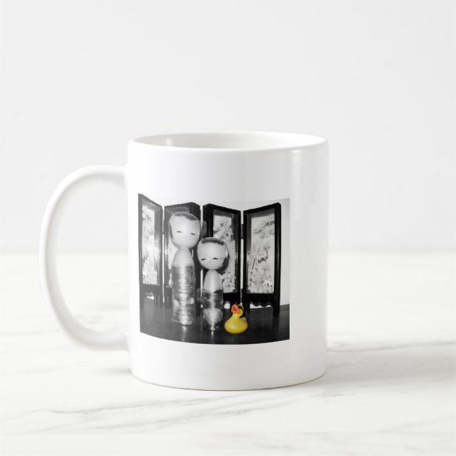 Taza de goma del pato de la "experiencia cultural" (Izquierda)