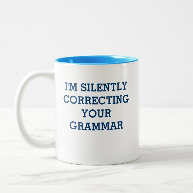 Taza de la corrección de la gramática (Izquierda)