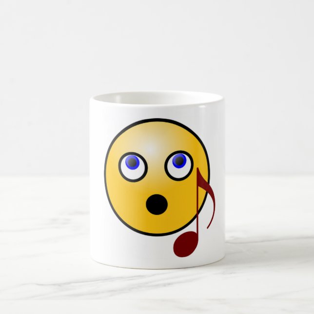 Taza de la emoji del canto (Centro)