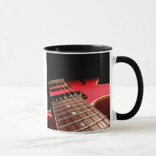 Taza De la guitarra del cierre rojo original eléctrico