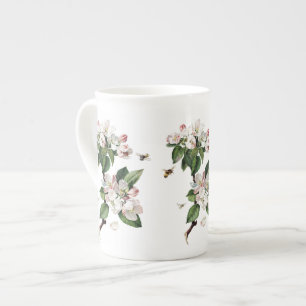 Taza de la porcelana de hueso de los flores y de
