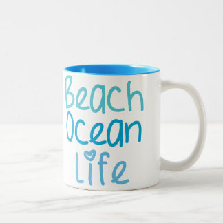 Taza de la vida del océano de la playa