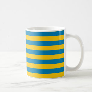 Taza de las rayas del azul y del oro